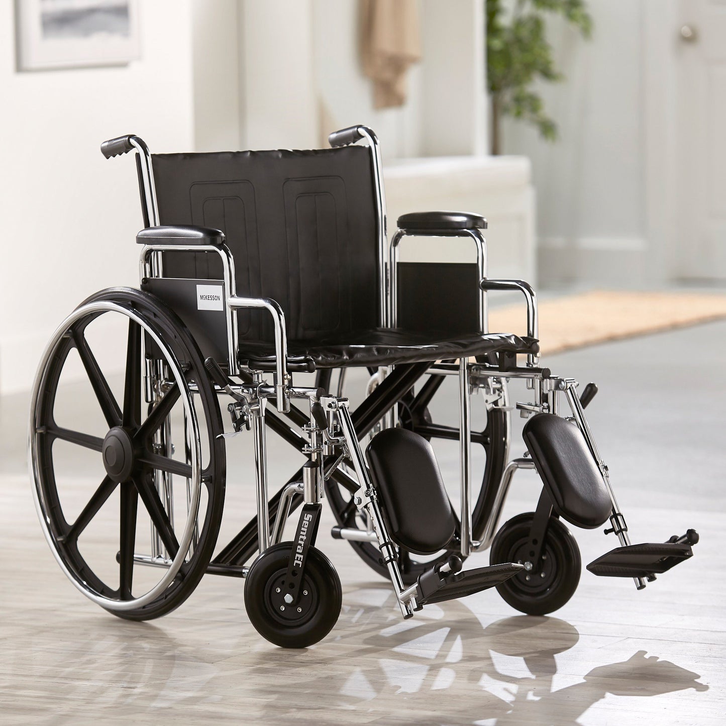 McKesson Bariatric Wheelchair Dual Axle Desk Length Arm Swing-Away Elevating Legrest Black Upholstery 24 Inch Seat Width Adult 450 lbs. Weight Capacity (1065289_EA)