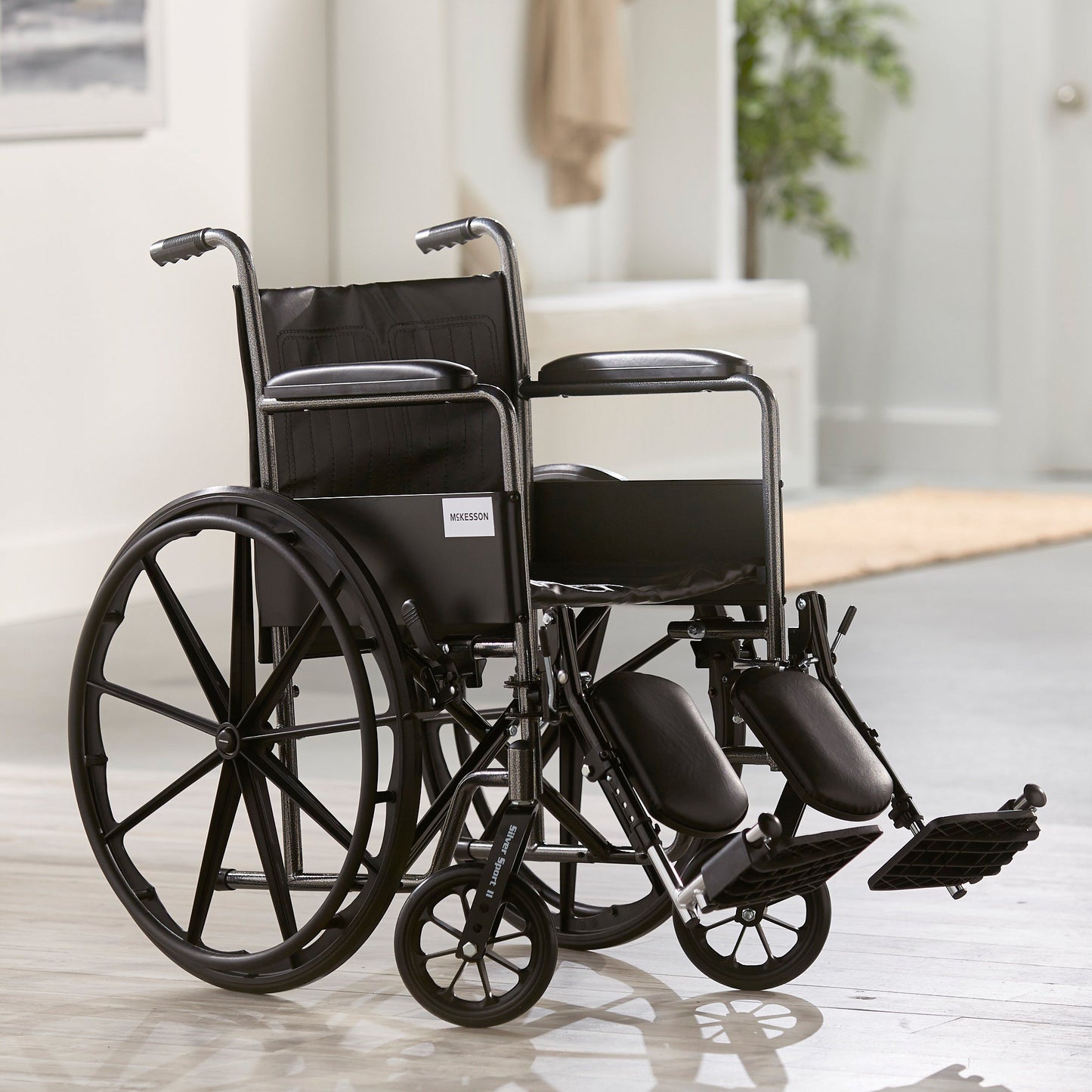 McKesson Wheelchair Dual Axle Full Length Arm Swing-Away Elevating Legrest Black Upholstery 18 Inch Seat Width Adult 300 lbs. Weight Capacity (1065275_EA)