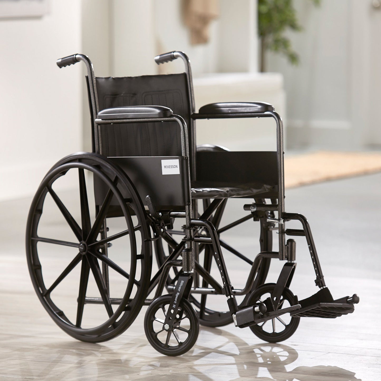 McKesson Wheelchair Dual Axle Full Length Arm Swing-Away Footrest Black Upholstery 18 Inch Seat Width Adult 300 lbs. Weight Capacity (1065274_EA)